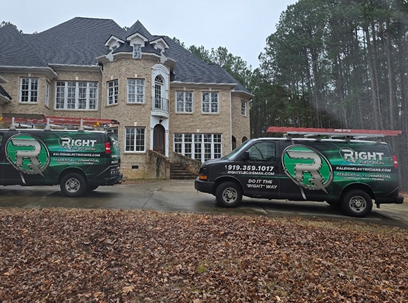 Right electrical vans parked in front of home